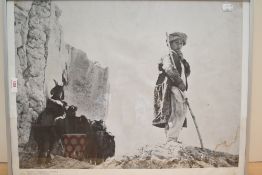 A framed photographic print of Goatherd at Tashkurghan Afganistan measuring 42cm x 60cm