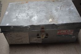 A large metal trunk having age related damage to lid, measures 68cm x 37cm x 28cm.