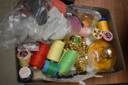A small amount of assorted haberdashery items including threads, beads and buttons etc sold