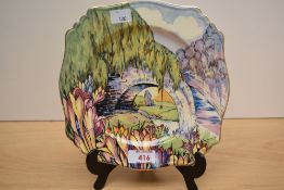 A brightly patterned transfer printed and hand coloured Art Deco design plate, having bridge and