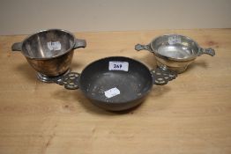 A 19th Century pewter quaich, measuring 20cm in diameter, together with two other silver plated
