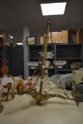 A Victorian brass three branch ceiling light fitting with applied leaf moulded decoration, measuring
