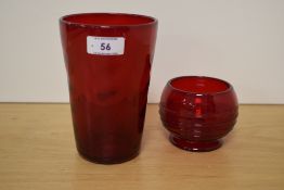 A Whitefriars glass ruby red wave ribbed tumbler vase, designed by Marriot Powell, catalogue