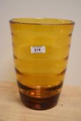A 1930s Whitefriars glass 'Golden Amber' internally ribbed optic vase of slightly tapering