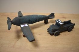 An early 20th Century hand crafted wooden plane on wheels, 'Bluebird', measuring 32cm long, and a