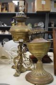 A 19th Century brass table lamp, converted from an oil lamp and measuring 52cm high, together with