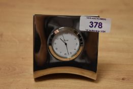 A stylish Dansk desk clock in silver plated, angular surround and measuring 9cm high