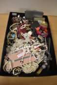 A large assortment of costume jewellery including paste set examples, beaded jewellery, brooches,
