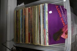 An assorted collection of approximately 100 LP records, of mixed genres including Rock, Pop,