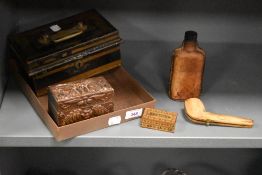 A vintage painted metal cash box, leather covered glass bottle, cased pipe, inlaid stamp box and