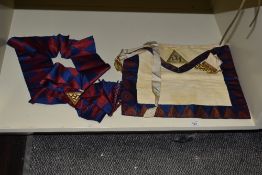 A Masonic kid leather apron with matching sash.