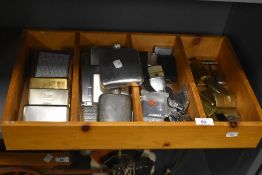 A pine four division tray containing various engraved metal cigarette and other boxes, hip flasks,