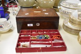 A large wooden jewellery box, having mother-of-pearl inlay, containing an assortment of costume