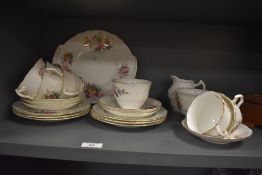 A mid-20th Century Coalport 'Junetime' patterned tea set, to include teacups and saucers, side