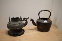 A 19th Century bronzed metal kettle, of Eastern design with missing handle, measuring 16cm high,