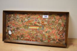 An early 20th Century cigar label decoupage tray, of rectangular form and under glass, measuring