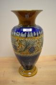 A large Royal Doulton Stoneware vase, decorated with a band of acanthus scrolls and flowerheads,