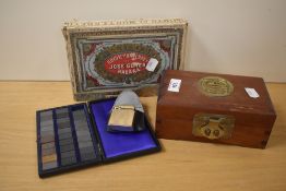 A 20th Century Chinese hardwood jewellery box, having applied brass motif to the lid and lined