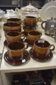 Six retro treacle glazed teacups and saucers and matching bowls