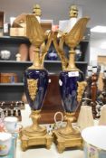A pair of 19th Century French cobalt blue porcelain and gilt metal mounted lamps, each measuring