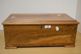 A 19th/20th Century walnut inlaid Swiss musical box, with inlaid stringing, measuring 20cm x 40cm