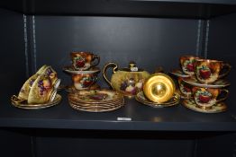 A selection of Aynsley and Evesham patterned teaware, of Royal Worcester style and decorated with