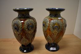 A pair of late 19th Century Doulton Lambeth pottery vases, decorated with a stylised Art Nouveau