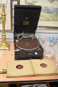 An early 20th Century HMV gramophone together with an assorted collection of records, including