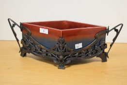 An early 20th century German Jugendstil ceramic and patinated metal planter, of lozenge form with