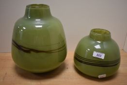 Two attractive mid-century green glass vases, each of mallet form with central trailed band,