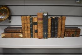 An assorted selection of leather bound antiquarian books, to include 'Bunyan's Pilgrim Progress', '