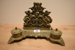 A 20th Century reproduction gilt metal desk stand, of Continental style, having two integrated