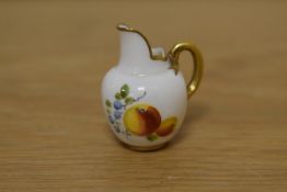 A miniature dolls Royal Worcester bone china tusk jug, decorated with foliate sprays and gilt
