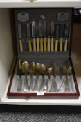 A selection of mixed cutlery, some with ivorine handles and in the rattail pattern, displayed within