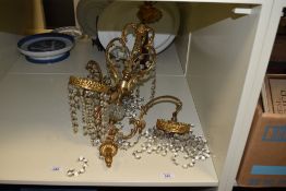 An early 20th Century Continental gilt metal ceiling light fitting, having three branches of faceted