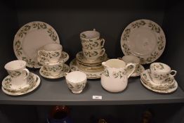 A part Crown Staffordshire fine bone china teaset, decorated with dog rose design and comprising