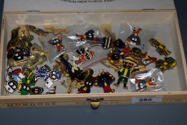 A selection of enamelled Robertson jam jar figure pin badges