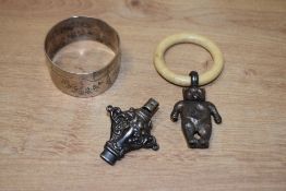 A 1920s Birmingham silver engraved napkin ring, silver and bone teething ring and rattle