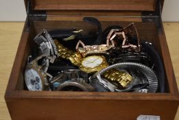 A wooden jewellery box, containing a selection of wristwatches, including Vialli, Geneva and Oskar