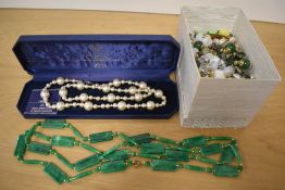 A cased string of Lotus imitation pearls, sold along with an assortment of beaded necklaces and a