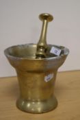 A cast-Brass pestle and mortar, of traditional design, the mortar flared and slightly deeper than