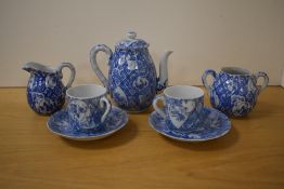 A 20th Century Chinese blue and white teapot, with bamboo effect handle, together with two coffee