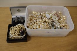 An assortment of costume jewellery, comprising various faux pearls, beaded necklaces and a pair of