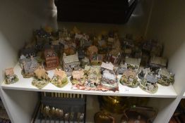 A large collection of Lilliput Lane cottage ornaments, the largest measures 12cm high