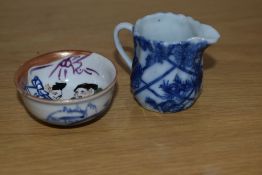 A 19th Century blue and white porcelain miniature jug, measuring 5cm, and a Chinese polychrome