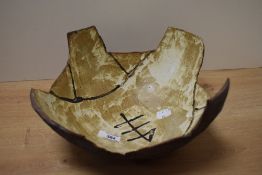 A mid-20th Century studio pottery fruit bowl, of angular form and having incised 'MH' initials to