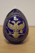 A Russian engraved and gilt enriched blue glass egg, On Motif of Faberge, St Petersberg Russia,