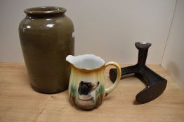 A large glazed stoneware jar, unmarked 27cm, a cast iron three branch shoe last and a mid 20th