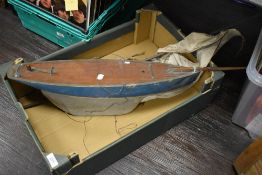 A 20th Century blue painted pond yacht, with sails, measuring 75cm long