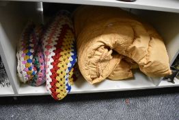 A 20th Century multi-coloured, hand-crocheted throw, measuring 150cm x 190cm, and a Bansun eiderdown